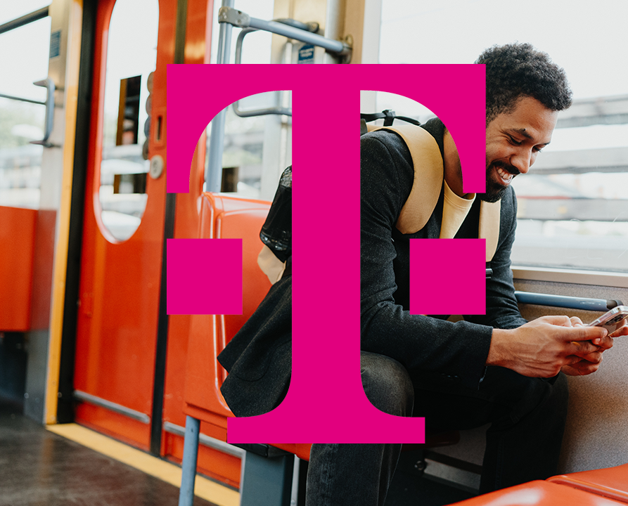 Man checking phone in train with the Telekom logo