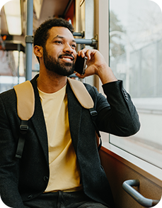 Man talking on the phone on a train